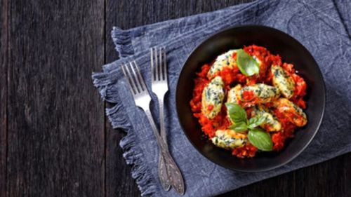 Găluște tradiționale italiene din ricotta și spanac, unul dintre cele mai cunoscute preparate ale bucătăriei din Lombardia. Sunt printre preferatele turiștilor străini prezenți la Olimpiadă